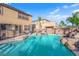 The backyard has a pristine pool with rock features and a waterfall for a serene outdoor experience at 3213 Salutare Ct, North Las Vegas, NV 89031