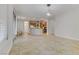 Expansive open-concept living area with neutral tile flooring, leading to a modern kitchen at 3504 Frigatebird Ln, North Las Vegas, NV 89084