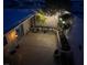 Private backyard with a seating area and string lights overhead at 3630 Mckinley Ave, Las Vegas, NV 89121