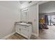 Bathroom featuring modern fixtures, granite counters, and a view to the bedroom at 3630 Mckinley Ave, Las Vegas, NV 89121
