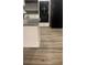Kitchen with a stove, refrigerator, and laminate wood flooring at 3630 Mckinley Ave, Las Vegas, NV 89121
