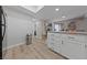 Bright kitchen featuring ample counter space, storage and modern wood-look floors at 3630 Mckinley Ave, Las Vegas, NV 89121