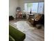 Cozy living space featuring a large window, comfortable seating, and a workspace at 3630 Mckinley Ave, Las Vegas, NV 89121