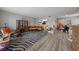 Open living area with modern decor and contemporary wood-look flooring throughout at 3630 Mckinley Ave, Las Vegas, NV 89121