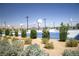 Outdoor basketball court featuring multiple hoops surrounded by desert landscaping and a beautiful mountain view at 3732 Via Gennaro, Henderson, NV 89044