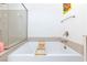 Bathroom showcasing soaking tub with wood rack and glass shower at 3732 Via Gennaro, Henderson, NV 89044