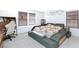 Well-lit bedroom with carpeted floors, large windows, and a unique bed at 3732 Via Gennaro, Henderson, NV 89044