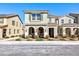 Charming two-story home featuring an arched front porch and low-maintenance landscaping at 3732 Via Gennaro, Henderson, NV 89044