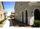 Stunning home exterior with stucco walls, blue shutters, and unique architectural details at 3732 Via Gennaro, Henderson, NV 89044