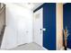 Bright foyer featuring neutral tile flooring and a striking blue accent wall at 3732 Via Gennaro, Henderson, NV 89044