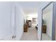 Hallway leads to bedrooms, media area, and a full-length mirror at 3732 Via Gennaro, Henderson, NV 89044