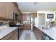 Modern kitchen with stainless steel appliances, stone backsplash and granite countertops at 3732 Via Gennaro, Henderson, NV 89044