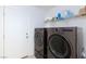 Convenient laundry room with washer, dryer, and storage shelves at 3732 Via Gennaro, Henderson, NV 89044