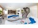 Spacious living room showcasing neutral tile flooring and an open floor plan at 3732 Via Gennaro, Henderson, NV 89044