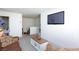 Spacious living room with a TV, comfortable seating, and views of the staircase at 3732 Via Gennaro, Henderson, NV 89044