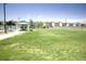 Scenic park featuring a gazebo, green grass, walking path, and a fence offering residents a tranquil retreat at 3732 Via Gennaro, Henderson, NV 89044
