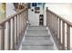 Carpeted staircase with wooden railings leading to the upper level at 3732 Via Gennaro, Henderson, NV 89044