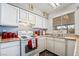 Bright kitchen showcasing white cabinetry, modern appliances, and a window over the sink area at 436 Bell Ave, Henderson, NV 89015