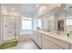 Bright, spacious bathroom with double vanity, a separate shower and tub, and modern fixtures at 4364 Contour Bend Ave, North Las Vegas, NV 89084