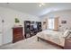 Comfortable bedroom features carpet floors, a bed, dark wood furniture, and a bright window at 4364 Contour Bend Ave, North Las Vegas, NV 89084
