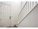 Bright entryway featuring a white door, staircase with white banister and wood-look floors at 4364 Contour Bend Ave, North Las Vegas, NV 89084