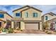 Charming two-story home with neutral stucco, a brick driveway, and a well-maintained front yard at 4364 Contour Bend Ave, North Las Vegas, NV 89084