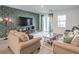 Inviting living room featuring stylish accent wall, tile floors, and modern furniture at 4364 Contour Bend Ave, North Las Vegas, NV 89084