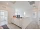 Bright loft featuring a built in desk and cabinets, white walls, carpet floors and two windows at 4364 Contour Bend Ave, North Las Vegas, NV 89084