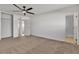 Spacious bedroom with a ceiling fan, closet and doorway leading to the ensuite bathroom at 4578 Ridgedale Ave, Las Vegas, NV 89121