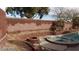 Backyard featuring a swimming pool, jacuzzi, fire pit, and desert landscape at 4798 Luna Ridge Ct, Las Vegas, NV 89129