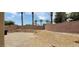 Spacious backyard featuring a gravel ground cover and brick perimeter wall at 4798 Luna Ridge Ct, Las Vegas, NV 89129