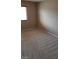 Bedroom with neutral walls and base molding with large window at 4798 Luna Ridge Ct, Las Vegas, NV 89129