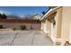 Wide driveway and a desert landscape with a block wall and an outdoor light post at 4798 Luna Ridge Ct, Las Vegas, NV 89129