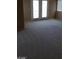 Carpeted living room features a patio door and window at 4798 Luna Ridge Ct, Las Vegas, NV 89129