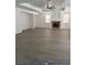 Spacious living room featuring hardwood floors, fireplace and large window at 4798 Luna Ridge Ct, Las Vegas, NV 89129