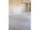Spacious living room with neutral walls and plush carpeting offers a blank canvas for personalization at 4798 Luna Ridge Ct, Las Vegas, NV 89129