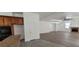 Open-concept living room featuring wood floors, fireplace, and seamless transition to the kitchen area at 4798 Luna Ridge Ct, Las Vegas, NV 89129