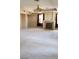 Spacious living room with a fireplace and neutral carpet at 4798 Luna Ridge Ct, Las Vegas, NV 89129