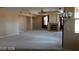Living room with neutral walls, carpeting, a fireplace, and overhead lighting at 4798 Luna Ridge Ct, Las Vegas, NV 89129