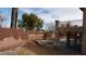 Backyard view featuring a brick retaining wall, patio, and a sparkling in-ground pool and spa at 4798 Luna Ridge Ct, Las Vegas, NV 89129