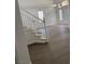 Hallway featuring a staircase, light-colored walls, and access to various rooms at 4798 Luna Ridge Ct, Las Vegas, NV 89129