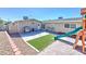 Backyard featuring a playset, artificial turf, and sand for outdoor fun at 524 8Th St, Boulder City, NV 89005
