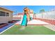 Backyard featuring a playset, artificial turf, and sand for outdoor fun at 524 8Th St, Boulder City, NV 89005