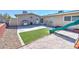 Backyard featuring a playset, artificial turf, and sand for outdoor fun at 524 8Th St, Boulder City, NV 89005