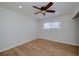 Bright bedroom features hardwood floors, a ceiling fan, and a sun-filled window at 524 8Th St, Boulder City, NV 89005