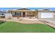 Charming single-story home with manicured lawn, brick accents, and a two-car garage at 524 8Th St, Boulder City, NV 89005