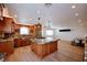Open-concept kitchen with a large island, granite countertops, and stainless steel appliances at 524 8Th St, Boulder City, NV 89005