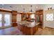 Gourmet kitchen featuring a large island, custom cabinets, and stainless steel appliances at 524 8Th St, Boulder City, NV 89005