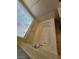 Corner bathtub with a view from the window and tile flooring at 5413 Bristol Bend Ct, Las Vegas, NV 89135