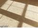 Close-up of bedroom carpet with sunlit window shadows and soft texture at 5413 Bristol Bend Ct, Las Vegas, NV 89135